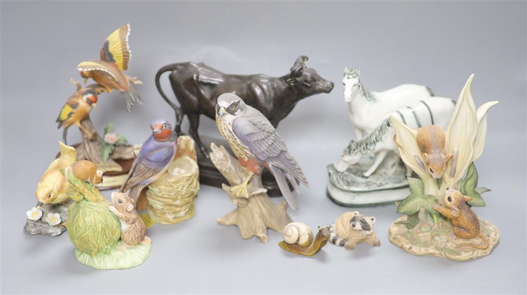 A patinated spelter figure of cow, signed C. Valton and a group of porcelain animal and bird figures